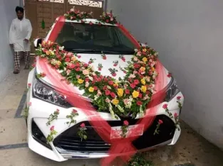 Fresh flowers decorating cars and masheery
